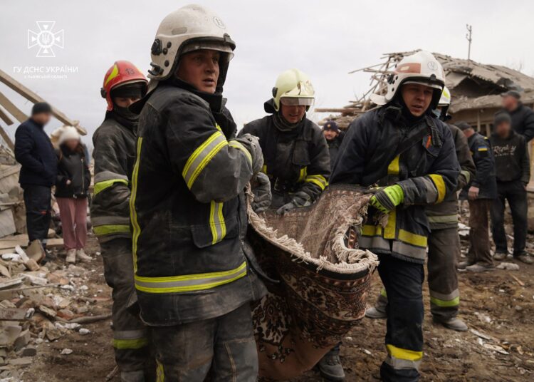 This handout photograph taken and released by Ukrainian Emergency Service on March 9, 2023 in Lviv region shows the rescuers carrying body of a man following a Russian missile strike. (Photo by Handout / UKRAINIAN EMERGENCY SERVICE / AFP) / RESTRICTED TO EDITORIAL USE - MANDATORY CREDIT "AFP PHOTO / UKRANIAN EMERGENCY SERVICE  " - NO MARKETING NO ADVERTISING CAMPAIGNS - DISTRIBUTED AS A SERVICE TO CLIENTS