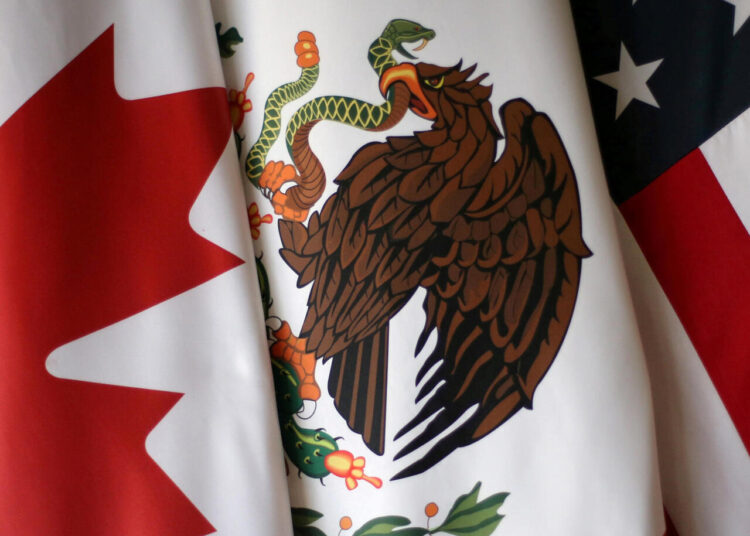 FILE PHOTO: Flags are pictured during the fifth round of NAFTA talks involving the United States, Mexico and Canada, in Mexico City, Mexico, November 19, 2017.  REUTERS/Edgard Garrido/File Photo